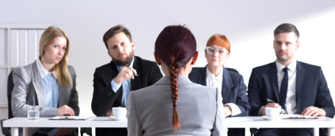 Woman during job interview and four elegant members of management; Shutterstock ID 370947476; PO: angelikiJ-for robin kawakami