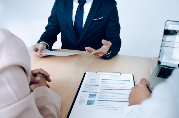 6015cd2990820a52732c9f9c_Why-are-you-looking-for-a-new-job a person interviewed by two people